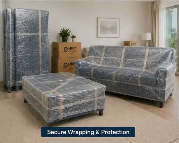 Moving crew loading wrapped furniture into a truck