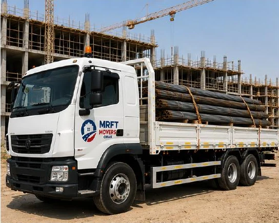 Heavy truck carrying industrial cargo on an Oman road