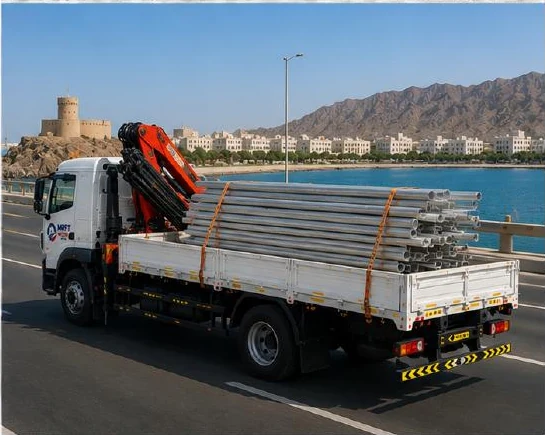 HIAB crane truck carrying long materials on an Oman route